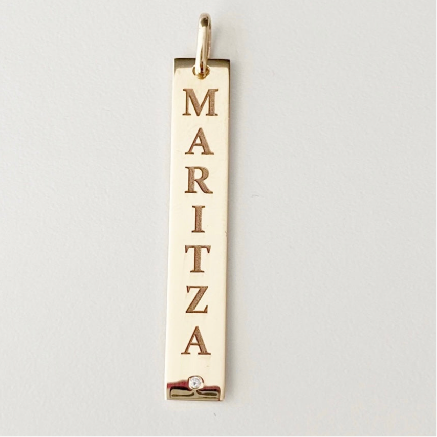gold name necklace
personalized gold pendant
14Kt gold bar necklace
engraved name bar pendant
zircon gold pendant
minimal gold necklace
custom gold jewelry
everyday gold necklace
vertical bar pendant
fine jewelry for women