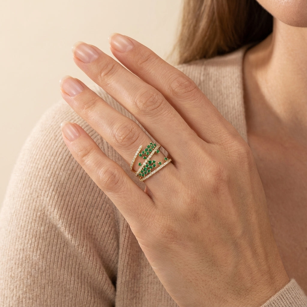 Luxury constellation ring in 14Kt gold, featuring green gemstones and accent diamonds.