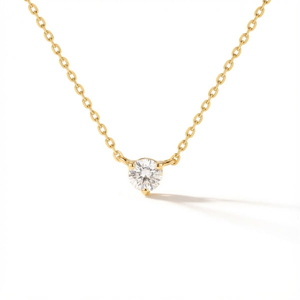 Dainty 14Kt gold chain necklace with a sparkling round zirconia solitaire pendant.