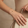 14Kt gold bracelet with three heart charms and two bezel-set diamonds, dainty luxury jewelry for women. photography by Morelove Designs