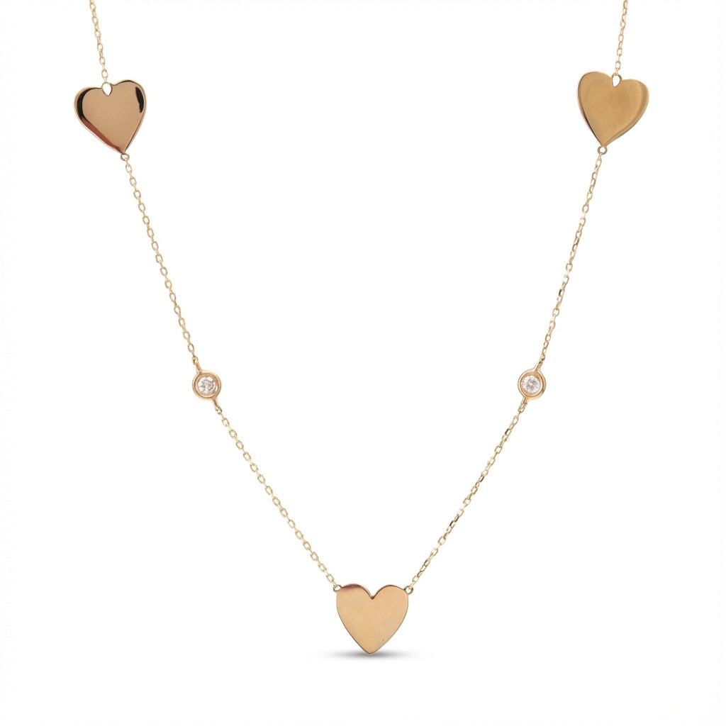 14Kt gold necklace with three heart charms and two bezel-set diamonds product photo by Morelove Designs