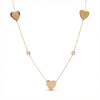 14Kt gold necklace with three heart charms and two bezel-set diamonds product photo by Morelove Designs
