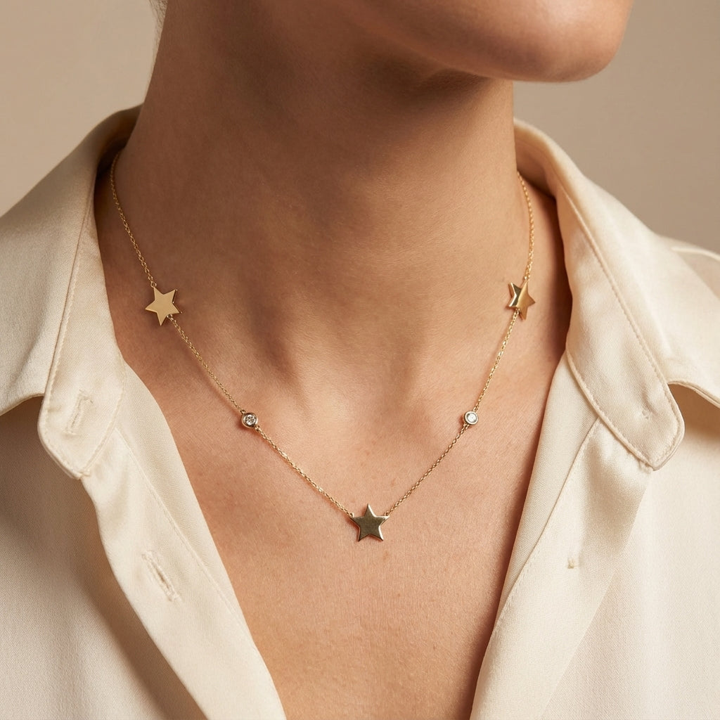 14Kt gold necklace with 3 star charms and diamond accents photography by Morelove Designs