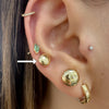 Gold 14Kt button flat earrings shown worn on lobe, paired with helix and cartilage piercings
