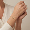 Single Cross Shaped Bracelet with Side Bezel Diamonds in 14Kt Gold