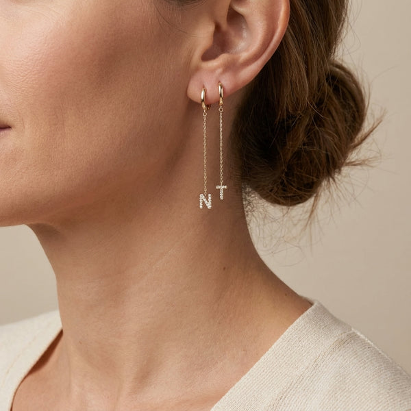 14kt gold earring enhancer with mini pave diamond initial charm, personalized fine jewelry photography by Morelove Designs