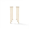 Elegant 14Kt gold diamond fringe earrings, featuring three delicate chains with diamond drops on a woman's earlobe.