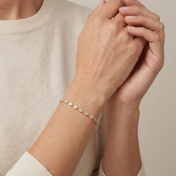 Full Round Bezel Diamond Bracelet 14kt Gold photography by Morelove Designs