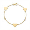 14Kt gold bracelet with three heart charms and two bezel-set diamonds, dainty luxury jewelry for women. product photo by Morelove Designs