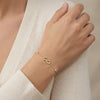 14Kt gold bracelet with three heart charms and two bezel-set diamonds, dainty luxury jewelry for women. photography by Morelove Designs