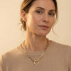 Minimalist 14K yellow gold elongated link necklace with a prominent O-ring detail, ideal for quiet luxury styling.