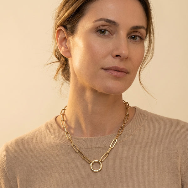Minimalist 14K yellow gold elongated link necklace with a prominent O-ring detail, ideal for quiet luxury styling.