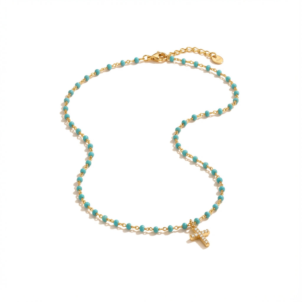 Golden Plated Silver necklace with small blue beads and a sparkling mini cross pendant.