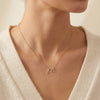 14K Gold diamond initial M necklace, modern micro pave script letter pendant photography by Morelove Designs