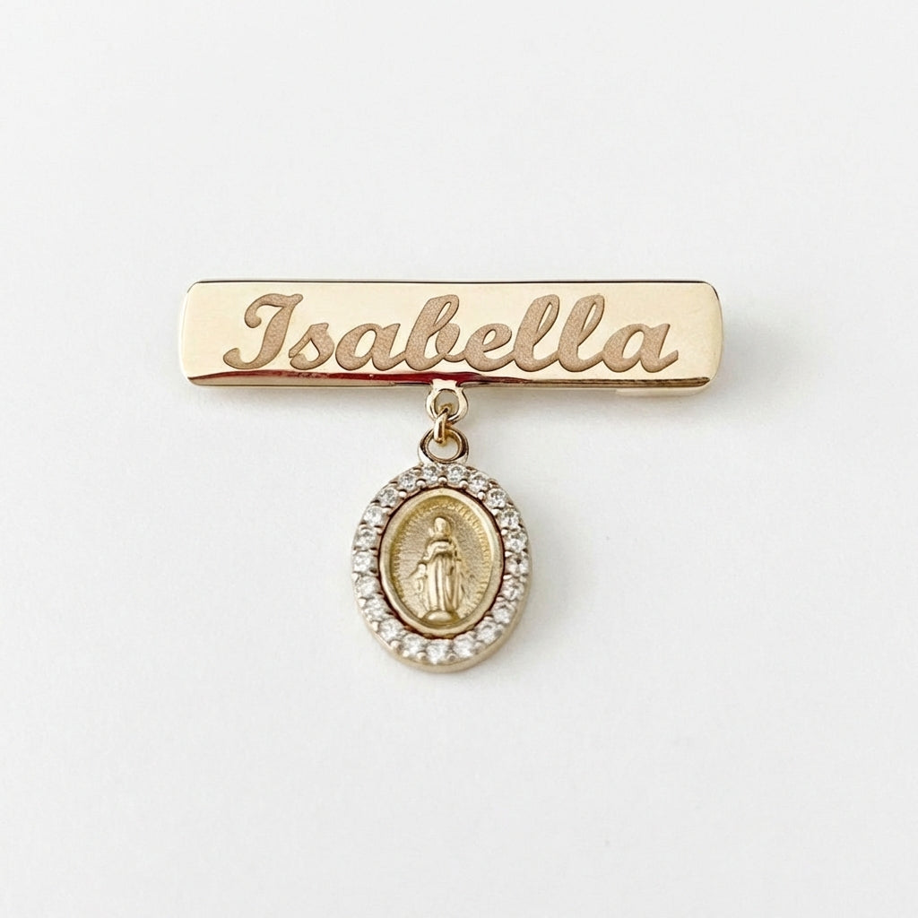14Kt gold personalized name bar safety pin, "Isabella" engraved, with mini Miraculous Medal charm for kids. product photo by Morelove Designs