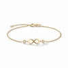 14Kt gold infinity bracelet with pave diamonds; delicate wrist jewelry for adults. product photo by Morelove Designs