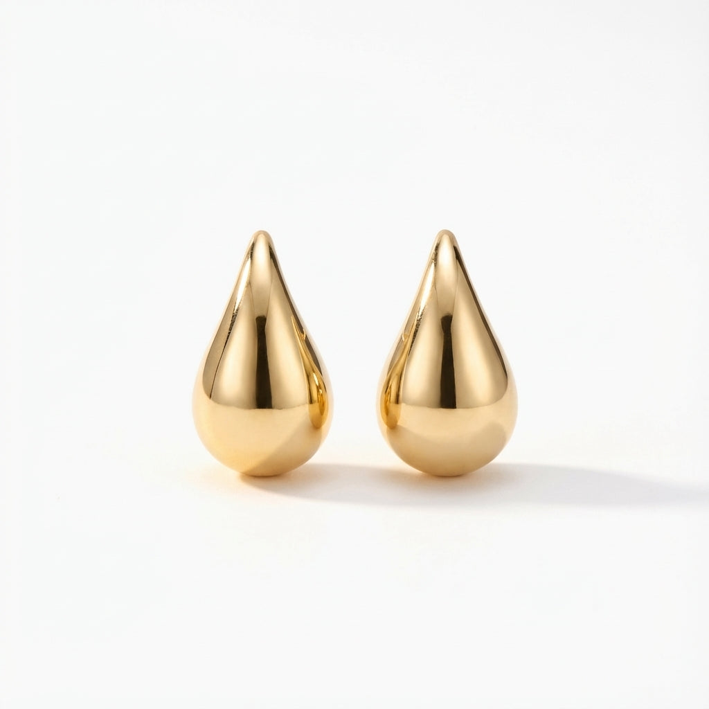 14Kt gold puff drop earrings, minimalist jewelry style, shiny teardrop shape