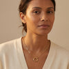 Chic gold everyday necklace for adults, with a unique round link accent and mixed chain styles.