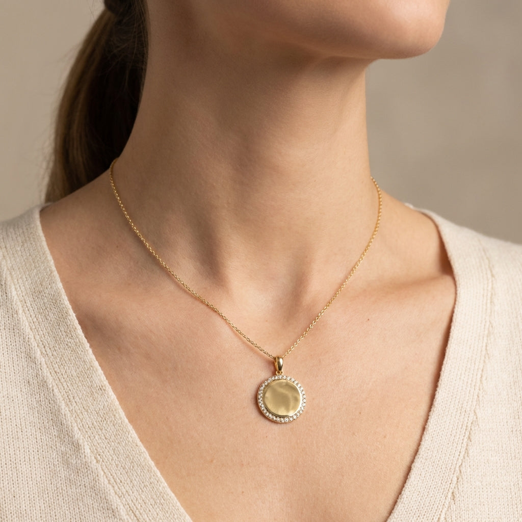 Gold 14Kt round medallion pendant with sparkling diamonds, perfect for personalization or gifts. photography by Morelove Designs