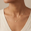 14kt gold disk necklace with diamond bezel photography by Morelove Designs