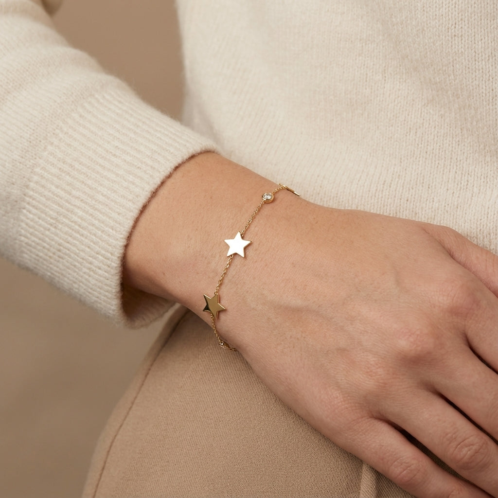 14Kt gold bracelet with three heart charms and two bezel-set diamonds, dainty luxury jewelry for women. photography by Morelove Designs