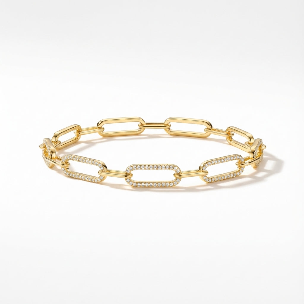 Close-up of an elegant golden plated silver bracelet with sparkling zirconia detailed elongated links.