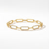 Close-up of an elegant golden plated silver bracelet with sparkling zirconia detailed elongated links.