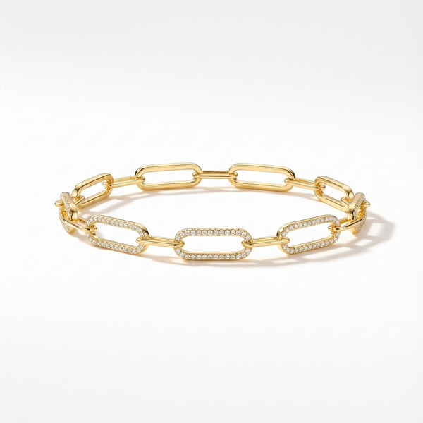 Close-up of an elegant golden plated silver bracelet with sparkling zirconia detailed elongated links.